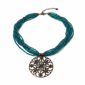 Vintage turquoise blue beaded necklace with gold tone floral medallion